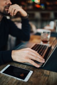 Kaboompics - Man, laptop, mobile phone