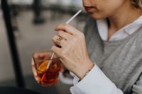 Kaboompics - Woman Drinking Aperol Spritz at Outdoor Cafe
