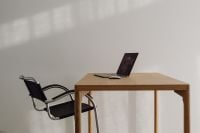 Kaboompics - Minimalist Workspace With Laptop And Soft Wall Shadows