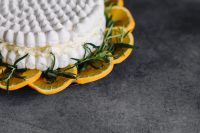 Kaboompics - Meringue Cake with whipped cream and oranges