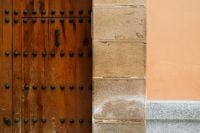 Kaboompics - Historic Wooden Door and Stone Facade in Spain
