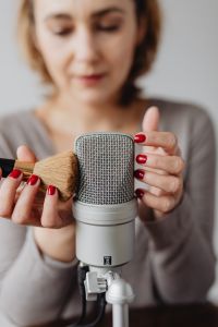 Kaboompics - Soft-Focus Woman and Microphone in a Calm ASMR Recording Portrait