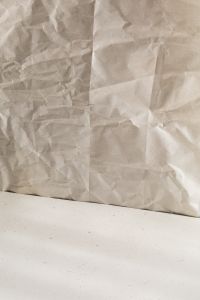 Kaboompics - Wrinkled Beige Paper Backdrop with White Floor