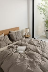 Kaboompics - Open Book on a Cozy Gray Bed by a Window