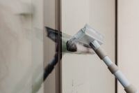 Kaboompics - Window Squeegee Wiping Glass in a Modern Interior