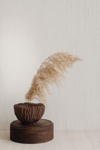 Kaboompics - Brown Pampas Vase on Round Wooden Pedestal, Minimal Neutral Home Decor Still Life