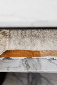 Kaboompics - clothes on marble shelf