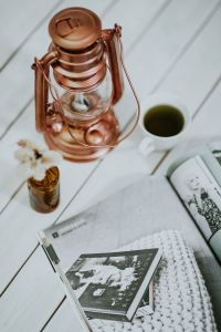 Magazine with a paraffin lamp on a white table