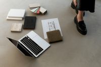 Kaboompics - Overhead Interior Design Workspace with Laptop, Floor Plan and Material Swatches