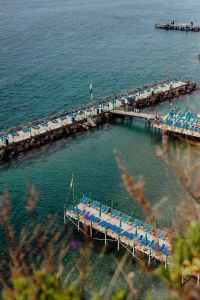 Kaboompics - Elevated View Of Blue Umbrella Piers On The Italian Mediterranean Coast