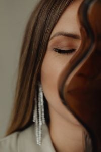 Kaboompics - Close-Up Portrait of Woman with Long Crystal Earrings