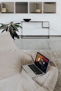 Cozy Home Office Laptop Workspace with Smartphone and Copy Space