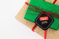 Kaboompics - 70 Percent Sale Tag on Green Gift Box and Gold Wrapped Present
