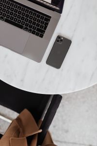 Kaboompics - MacBook Pro 15 laptop and iPhone 11 Pro on a marble table