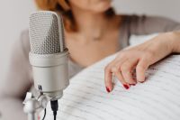 Kaboompics - Soft-Focus Microphone and Woman Touching a Ribbed Pillow for ASMR Sounds