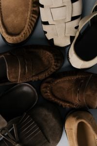 Kaboompics - Close-Up of Assorted Suede Loafers and Woven Sandals