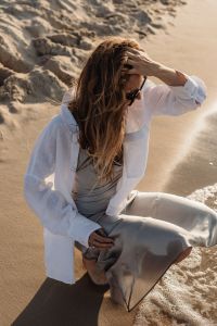 Kaboompics - Woman in White Shirt and Satin Skirt Beach Fashion Portrait