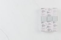 Kaboompics - Christmas Gift Box with Silver Tree Print on White Marble Copy Space