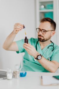 Kaboompics - Doctor Measuring Liquid With Glass Pipette