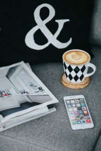 Kaboompics - Close-Up Latte Coffee, Smartphone and Magazine on Gray Sofa