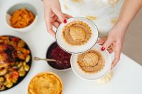 Kaboompics - Pumpkin Pies and Thanksgiving Sides on a White Table