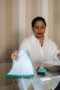 Kaboompics - Black Woman Holding Open Planner