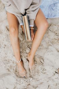 Kaboompics - Beach Vacation Flat Lay with a Book, Hat and Bare Legs