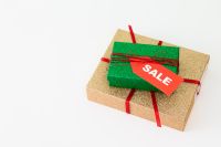 Kaboompics - Green and Gold Gift Boxes with Sale Tag on White Background