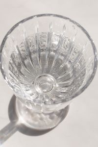 Kaboompics - Overhead Close-Up of a Faceted Crystal Glass on White Marble