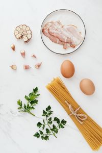 Kaboompics - Spaghetti, Eggs and Bacon Flat Lay With Copy Space