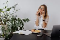 Kaboompics - Professional Woman on Phone With Laptop and Meal