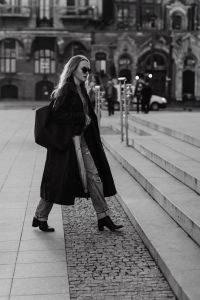 Kaboompics - Black and White Woman Walking Across a European City Square