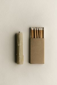 Kaboompics - Candle and Matchbox on White Minimal Background