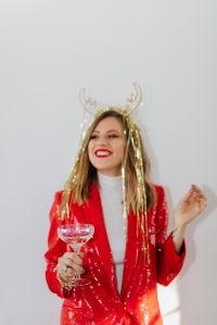 Kaboompics - Red Sequin New Year Portrait with Silver Streamers and Champagne