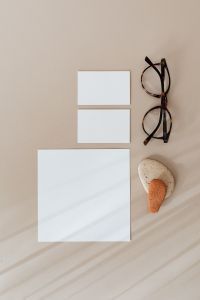Kaboompics - Blank Stationery Card Mockup with Glasses and Natural Stones