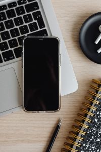 Kaboompics - Top View of Laptop, Smartphone, AirPods, Notebook and Pen