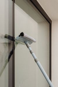 Kaboompics - Close-Up of Window Cleaning with a Squeegee