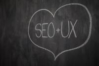Kaboompics - Close-Up Chalk SEO and UX Text in a Hand-Drawn Heart, Dark Blackboard Texture