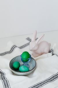 Kaboompics - Easter Bunny Figurine Beside a Bowl of Painted Green Eggs