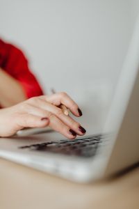 Kaboompics - Close-Up Hands Using Laptop Keyboard and Trackpad