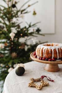 Kaboompics - Iced Bundt Cake with Wooden Star Ornament and Greenery