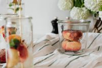 Kaboompics - Fresh Fruit in Glass Jars on Striped Linen