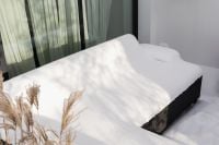 Kaboompics - Snow-Covered Outdoor Bed in Winter Sunlight