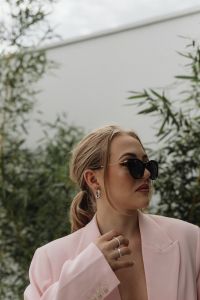 Kaboompics - Side Portrait of Woman in a Pale Pink Blazer and Sunglasses