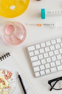 Kaboompics - Tablets and Laboratory Glassware Beside Computer Keyboard