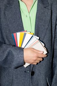 Kaboompics - Person in Gray Blazer Holding Color Swatches
