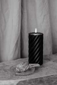 Kaboompics - Black Spiral Candle and White Sage Bundle on Marble, Monochrome Still Life