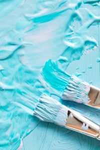 Kaboompics - Paint Brushes Applying Pale Blue Acrylic to a Textured Surface
