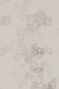 Kaboompics - Pastel Soap Bubbles on a Light Neutral Abstract Background