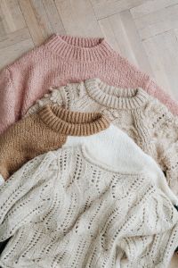 Kaboompics - Top View of Pink and Neutral Knitwear Arrangement